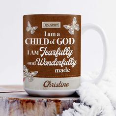 a coffee mug with the words i am a child of god, i am fearlessly and wonderfully made on it