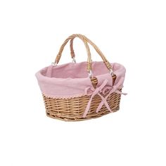 a wicker basket with pink linings and bows on the handle is shown in front of a white background