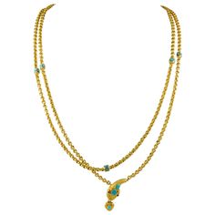 A Victorian turquoise and gold serpent chain necklace, a yellow gold muff chain set with nine turquoise beads within a yellow gold square, leading to an ornate serpent head set with turquoise and garnet eyes, the mouth suspending a heart shape turquoise set locket, circa 1860, measuring approximately 75cm long, gross weight 119 grams. This striking serpent chain comes from the collection of Bentley & Skinner, the London jewellers by appointment to both Her Majesty the Queen and His Royal Highnes Serpent Jewelry, Gold Collar Necklace, Historical Jewellery, Head Set, Turquoise And Gold, Locket Pendant Necklace, Gold Rope Chains, Her Majesty The Queen, Classy Photography