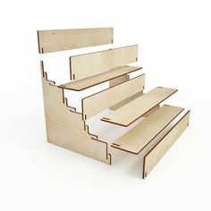 a set of three wooden steps on top of each other in front of a white background