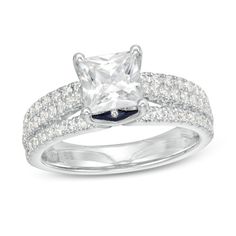 a princess cut diamond ring set with pave diamonds