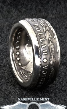 "This 1901 Silver Dollar Coin Ring was handmade from a 90% Silver 1901 US Morgan Dollar Coin, minted in 1901. It's available in sizes 9-23 including half and quarter sizes. This 3D coin ring reads \"ONE DOLLAR\", \"UNITED STATES OF AMERICA\" & \"IN GOD WE TRUST\" on the outside & \"E PLURIBUS UNUM\" with mint date \"1901\" (1879 pictured) on the inside. The band width is approximately 10 mm wide. $1 Silver Dollar Coin Rings can be found here: http://etsy.me/2jtdMKZ 50c ~~ Silver Half Dol Black Ring Box, Silver Coin Ring, 32nd Birthday, Silver Dollar Coin, Coin Rings, Silver Wedding Anniversary, Wedding Silver, Morgan Dollars, Silver Anniversary