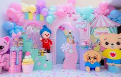 there are many toys in the room with balloons on the walls and decorations around them