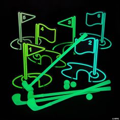 glow in the dark golf game set with neon green markers and tees on black background