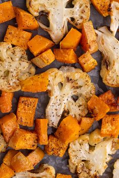 roasted cauliflower and squash on a baking sheet