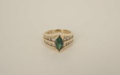 This is a Beautiful 14k yellow gold Emerald and Diamond ring.  The ring is sized at 6.25 and the band is 12.02mm wide and tapers down to 2.55mm wide at bottom center.  The marquise cut Emerald comes to approximately 1 carat and the 16 round cut diamonds come to approximately 0.75ct. **The dark spots that can be seen in some of the pictures are not on the item.  It is caused by the reflection of the camera used to take the photos.**All metal is tested with a Thermo Scientific Niton DXL precision Diamond Emerald Ring, Emerald And Diamond Ring, Store Hours, Beautiful Ring, Marquise Cut, Emerald Ring, Dark Spots, 1 Carat, Round Cut Diamond