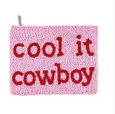 a pink and red pouch with the words cool it cowboy written in red on it