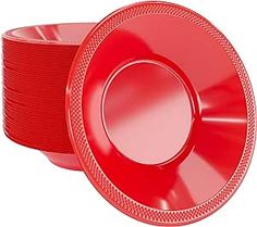 red plastic plates stacked on top of each other