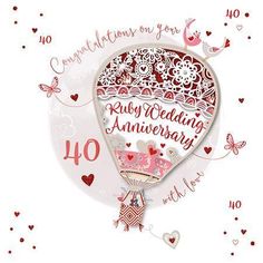 a red and white hot air balloon with the words ruby wedding anniversary written on it