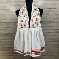 a white dress on a mannequin with food and drink images all over it