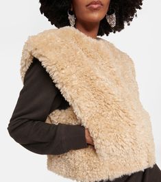 Feliz Faux Shearling Vest in Beige - Marant Etoile | Mytheresa Sleeveless Sheepskin Vest For Fall, Fall Sheepskin Sleeveless Vest, Chic Faux Fur Vest For Fall, Chic Sleeveless Outerwear With Faux Fur Trim, Faux Shearling Vest, Luxury Outerwear, Shearling Vest, Color Name, Vest Jacket