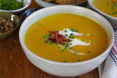 several bowls of soup are sitting on a table