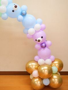 there is a bunch of balloons in the shape of bears on top of each other