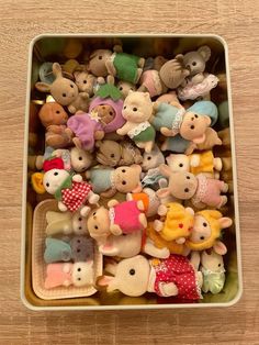 a box filled with lots of small stuffed animals