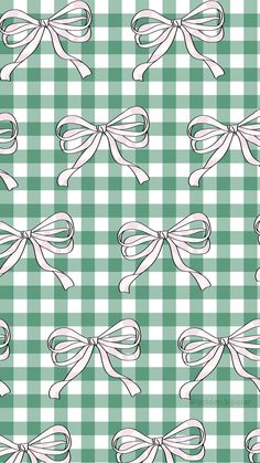 a green and white checkered pattern with bows