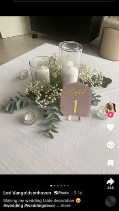 the table is set up with candles and flowers