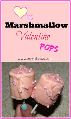 marshmallow valentine pops with pink frosting and sprinkles