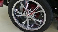 the wheel and tire of a car with chrome rims