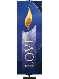 a blue and gold sign with the word love on it's side, in front of a white background