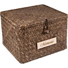 a large woven storage box with a name tag on the front and bottom, in brown