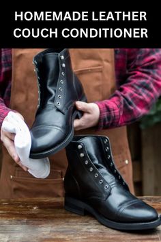 a man is holding two black boots and cleaning the inside of his shoes with a cloth