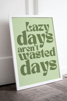 a green poster with the words lazy days aren't wasted days