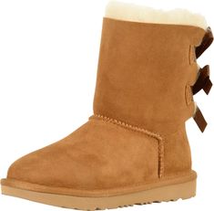 PRICES MAY VARY. Pretreated to repel stains and moisture Sheepskin lining Treadlite by UGG outsole for cushion, traction and durability Bow detail Ugg Bailey Bow, Mini Baileys, Bailey Bow Uggs, Bow Boots, Ugg Bailey, Bailey Bow, Sheepskin Boots, Kids Uggs, Ugg Classic