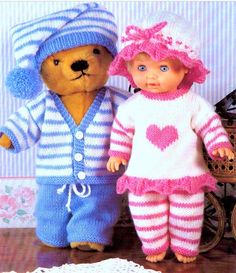 two teddy bears dressed in knitted clothing and hats