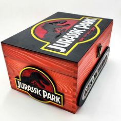 a wooden box with an image of a dinosaur on it