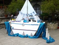 a sailboat decorated with blue and white decorations