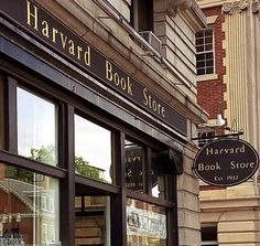 the store front of a book store with many books on it's display windows