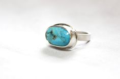 Natural Kingman turquoise(Arizona mine) set in .999 fine silver/.925 sterling silver with a sterling silver wide band(3.85x 1.55mm). This ring has a brushed/satin finish. READY TO SHIP. Each piece of jewelry is made by hand, formed, forged, hammered, and polished by me. Details * US Size: 6.75 * Kingman Turquoise: 17.85 x 10mm * .999 Fine Silver; .925 Sterling Silver * Handmade/Ready To Ship It comes beautifully packaged + mini card, gift ready! Thanks for stopping by! Modern Turquoise Sterling Silver Jewelry, Sterling Silver Turquoise Ring With Polished Finish For Anniversary, Sterling Silver Turquoise Ring With Polished Finish, Sterling Silver Turquoise Ring With Polished Finish As Gift, Untreated Turquoise Sterling Silver Ring For Anniversary, Untreated Turquoise Ring In Sterling Silver For Anniversary, Elegant Untreated Turquoise Ring In Sterling Silver, Modern Sterling Silver Turquoise Ring With Polished Finish, Modern Turquoise Sterling Silver Ring With Polished Finish