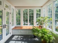 the sun room is clean and ready to be used for plants in pots on the windows sill