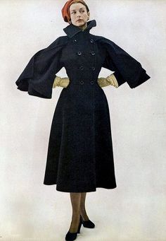 1947  wool coat with cape-sleeves by Claire McCardel late 40s black double breasted high collar princess style long full skirt 1950s Winter Fashion, Dorian Leigh, Twin Set Sweater, Claire Mccardell, Irving Penn, Vogue France, Fashion 1950s