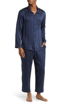 A classic button-up top pairs with matching bottoms in breathable silk pajamas that feel like a dream and can be cleaned in the washing machine. Top has front button closure; long sleeves; chest patch pocket Bottoms have elastic waist; side-seam pockets 100% silk Machine wash, dry flat Imported Blue Sleepwear With Button Closure For Loungewear, Blue Sleepwear With Button Closure, Casual Silk Long Sleeve Sets, Casual Silk Sets With Long Sleeve, Blue Silk Sleepwear For Pajama Party, Casual Silk Sleepwear For Pajama Party, Silk Casual Sleepwear For Pajama Party, Casual Silk Sleepwear For Loungewear, Silk Sleepwear For Loungewear In Casual Style