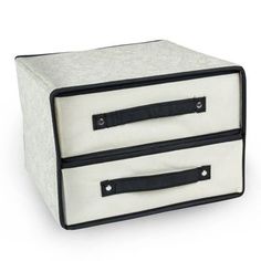 a white and black storage box with two drawers on the bottom, one drawer closed