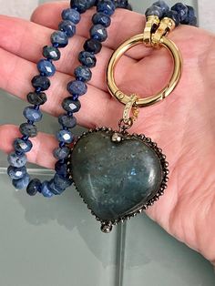 This is a beautiful hand-knotted Lapis Lazuli Rondelle semi-precious stone necklace with a large Labradorite Heart Shaped Pendant. These pendants are made from natural stones and each one is unique and beautiful, so it is not guaranteed you will receive the exact stone pictured. The Pendant is removable and has a micro pave bale . Please see photographs. Wear the necklace with or without the pendant. A true statement piece. Approximate size of pendant is 42mm x 40mm x 17mm: The length of the nec Hand-strung Heart Shaped Jewelry For Gift, Hand-strung Heart Shaped Jewelry Gift, Hand-strung Heart Jewelry As Gift, Hand-strung Heart Jewelry For Gift, Artisan Hand Knotted Jewelry For Gifts, Artisan Hand Knotted Jewelry As A Gift, Artisan Hand-knotted Jewelry For Gifts, Artisan Hand Knotted Necklace For Gift, Heart Shaped Pendant