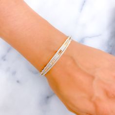 This rare and mesmerizing bangle, made from 22k gold, weighs 24.3 grams, beautifully combining yellow, white, and rose gold accents. With a size of 2.6 and a 2.35" opening, the elliptical design offers a unique twist to traditional bangles. Its exquisite finish adds a captivating allure, making it an extraordinary piece of art and a must-have for those with a penchant for rare, elegant accessories. Perfect as a standalone piece, it reflects a refined taste in jewelry PRODUCT DETAILS Gold Purity(karat): 22k Gold Weight(grams): 24.3 Item Finish: Yellow + White + Rose Gold Size: 2.6 Bangle Opening: 2.35" Number Of Pieces: 1 Bangle Rose Gold Accents, Rose Gold Bangle, Elegant Accessories, White Rose Gold, 22k Gold, Gold Accents, Gold Bangles, Yellow White, White Roses