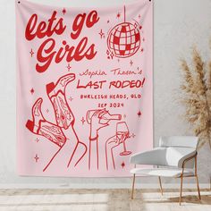 a pink wall tapestry with the words let's go girls on it