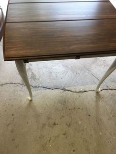 a wooden table sitting on top of a hard wood floor