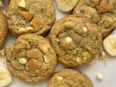 some cookies and bananas on a white surface