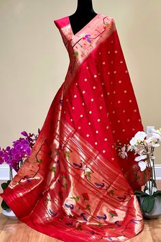 This exquisite regal paithani saree is handwoven in vermillion red color. Traditional gold zari coin buttis adorn the body while the golden zari border is decorated with handwoven brocade border. The elaborate pallu is woven with colorful peacocks along with winding vines and flowers. The saree comes with plain blouse with matching borders. Approximate Length 6.5 mtrs (inclusive of blouse length)Height - 48- 52" Approximate weight - 1.8 lbs Saree comes with fall and picot done. Blouse piece is c Luxury Cutdana Paithani Silk Dupatta, Red Paithani Saree, Vines And Flowers, Vermillion Red, Trendy Outfits Indian, Outfits Indian, Paithani Saree, Plain Blouse, Georgette Fabric