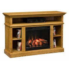 a wooden entertainment center with a fire place and bookshelf on the front side