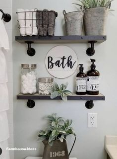 a bathroom with two shelves above the toilet and a potted plant next to it