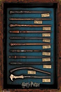 harry potter's wands are displayed in a wooden frame