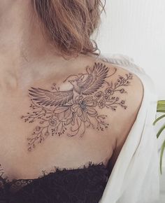 a woman with a bird tattoo on her chest