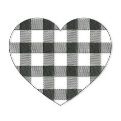 a black and white checkered heart shaped cutout with the shape of a plaid pattern