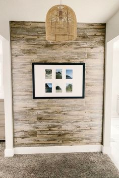 a wooden wall with pictures on it and a wicker basket hanging from the ceiling