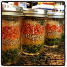 four jars filled with different types of food