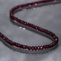 Garnet protects the wearer from negativity and evil thoughts. It induces passion, fire, energy, stability, and is believed to bring good luck in love and relationships. Garnet is a stone meant to bring success in life and helps to achieve the goals set in life by its possessor. Product Details : Handmade Necklace Gemstone : Garnet Gemstone Color : Purple Gemstone Treatment : Natural Gemstone Origin: Mozambique Gemstone Size : 3mm Gemstone Shape : Rondelle Gemstone Finish : Faceted Necklace Lengt Purple Garnet, Garnet Bracelet, Handmade Beaded Necklaces, Necklace For Girlfriend, Garnet Necklace, Necklace Minimalist, Gemstone Beaded Bracelets, Ruby Jewelry, Genuine Turquoise